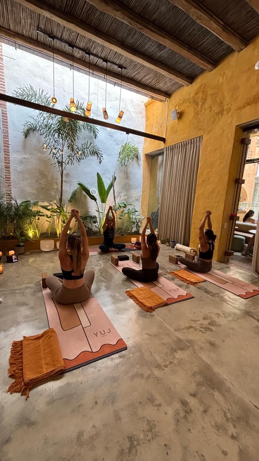 Seated meditation and yoga class in Cartagena Colombia — holistic wellness with Tata Umana