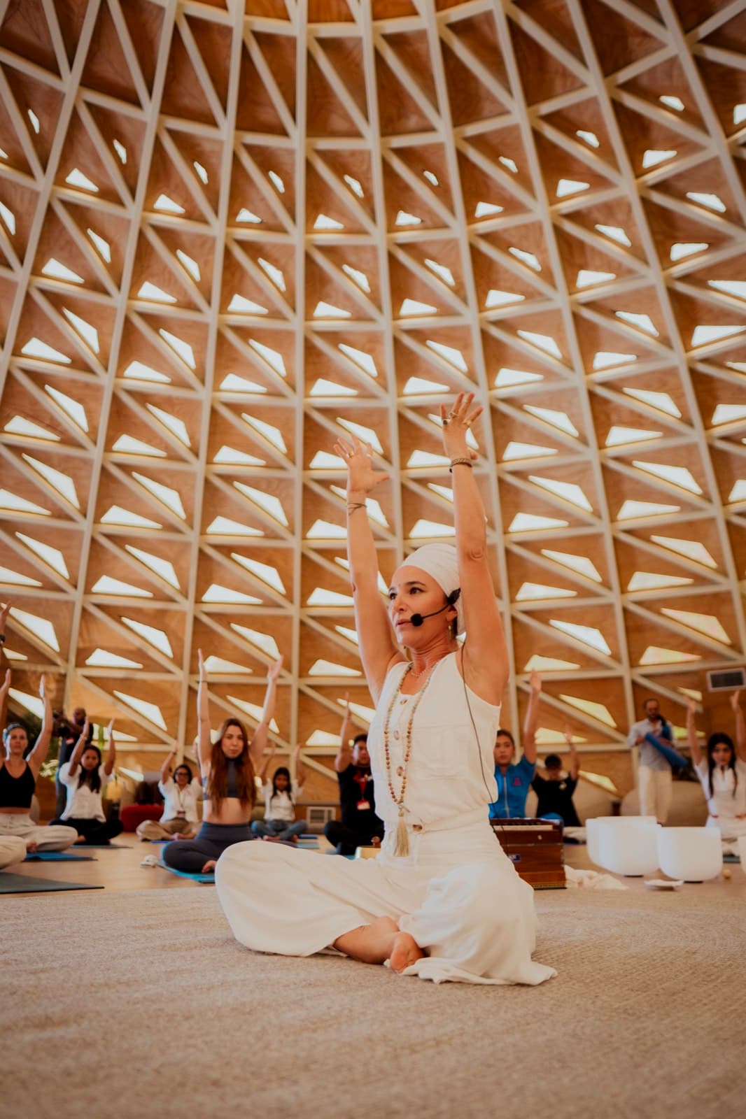 Tata Umana leading yoga and sound healing session at TUISYOU wellness event in Cartagena Colombia